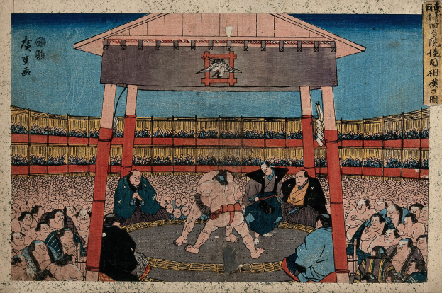 Ein Gemälde eines Sumo-Kampfes in einem Stadion, mit Zuschauern im Vordergrund und einer Hütte im Hintergrund, von Utagawa Kunisada Toyokuni III aus der Serie Fifty-Three Stations of the Tokaido.