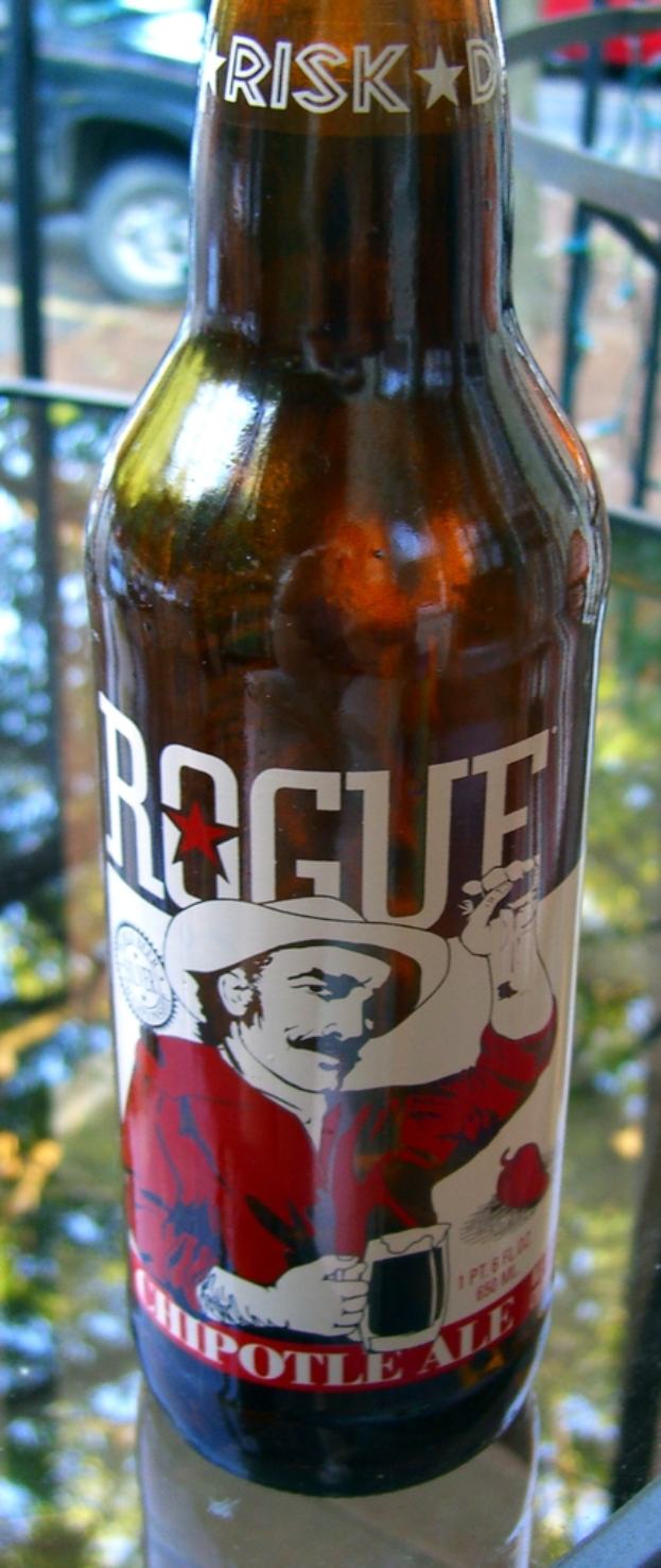 Eine Flasche Erfrischungsgetränk mit dem Wort "RISK" darauf, das einen Mann in rotem Hemd und Hut zeigt.