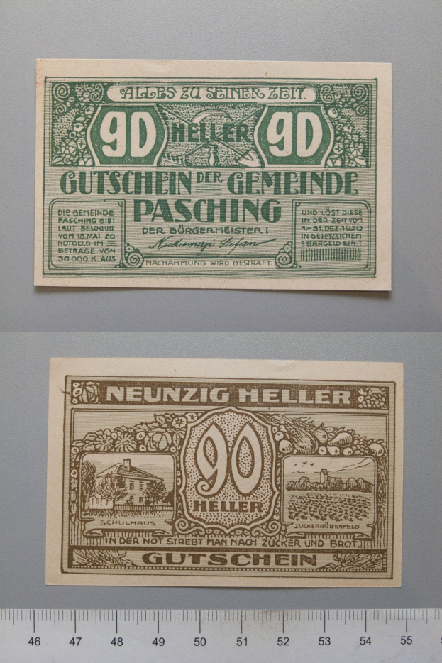 Alte deutsche Banknote mit Lineal daneben, mit gedrucktem Text und numerischen Werten, mit einer Skala am unteren Bildrand.