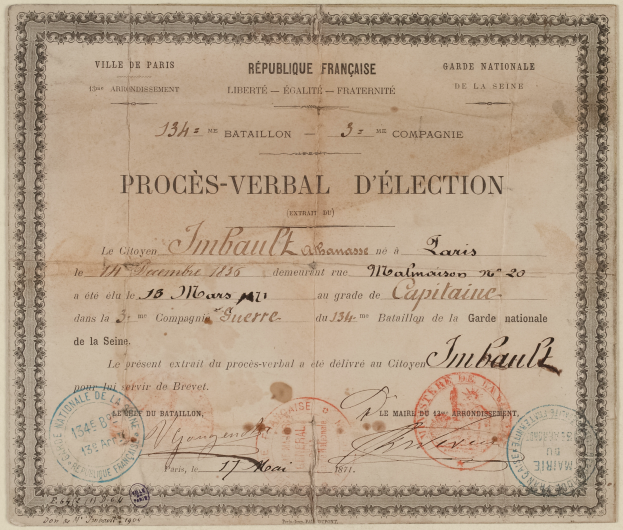 Ein altes Dokument, wahrscheinlich eine Wahlurne, mit zwei Stempeln darauf und Text darauf.